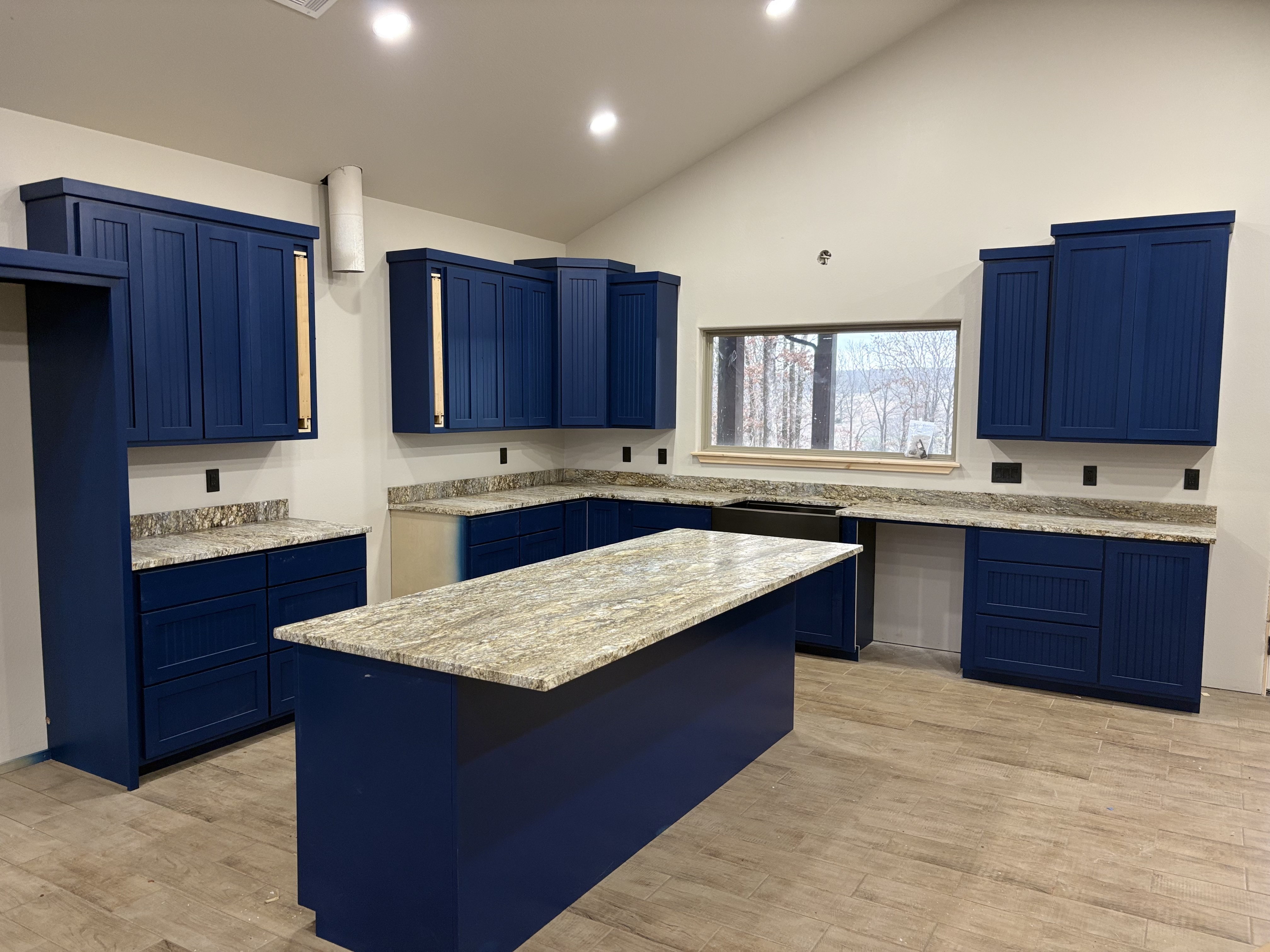 Blue cabinet kitchen with granite